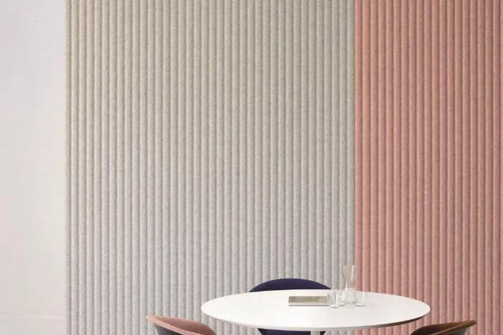 Lounge with an olive green fluted acoustic panel wall