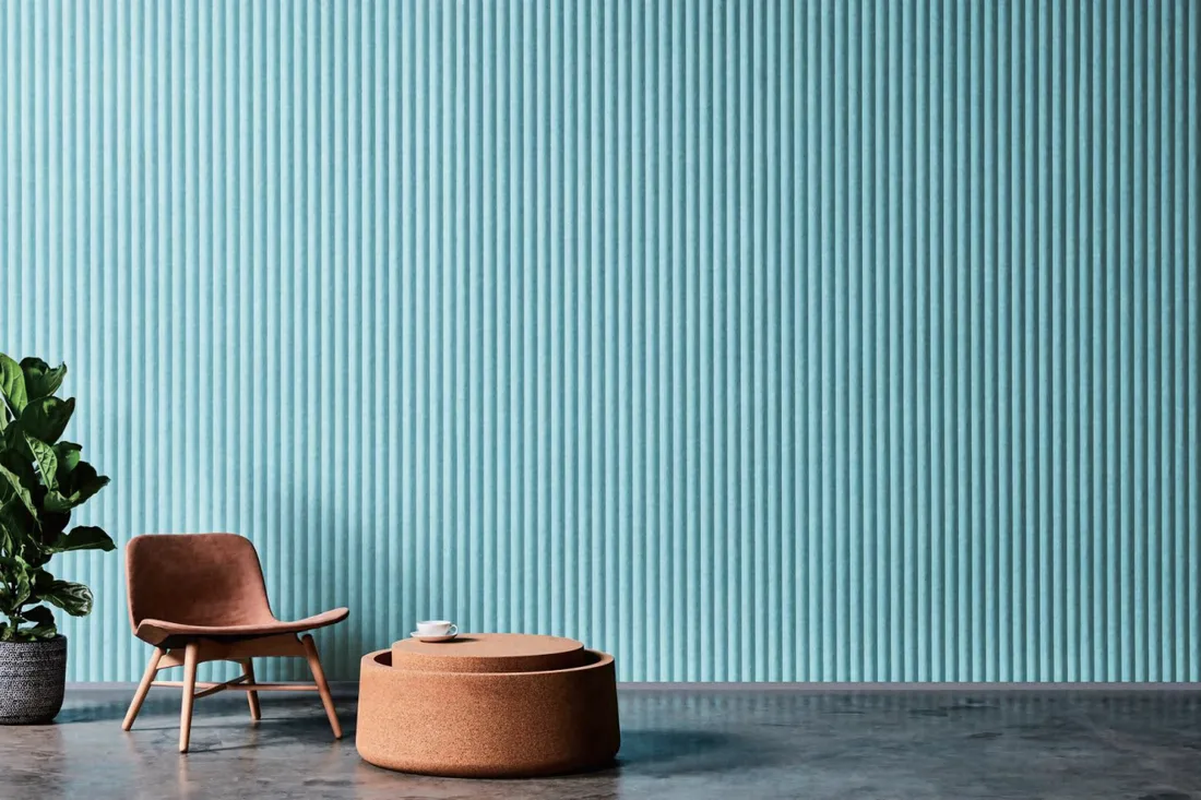 Lounge with an olive green fluted acoustic panel wall